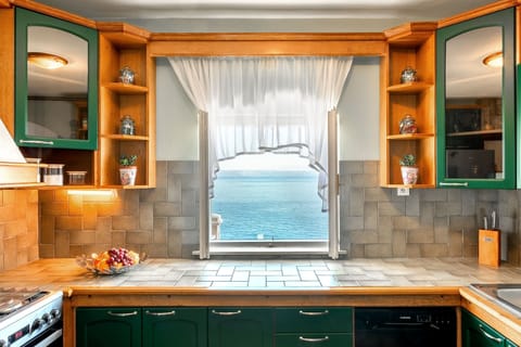 Villa | Private kitchen | Oven, electric kettle, toaster