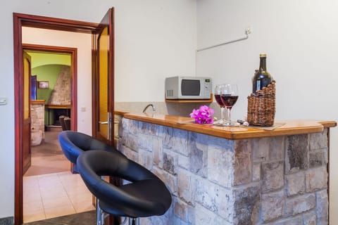 Villa | Private kitchen | Oven, electric kettle, toaster