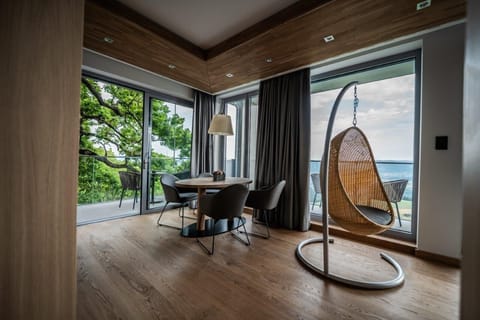 Exclusive Suite, 1 King Bed with Sofa bed, Slope side | Living area | LCD TV, heated floors