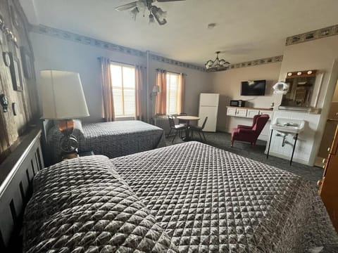 Family Room, 2 Queen Beds, Non Smoking | In-room safe, blackout drapes, bed sheets