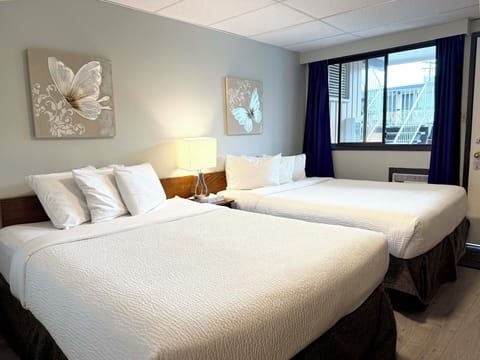 Room, 2 Queen Beds | 1 bedroom, laptop workspace, free WiFi, bed sheets