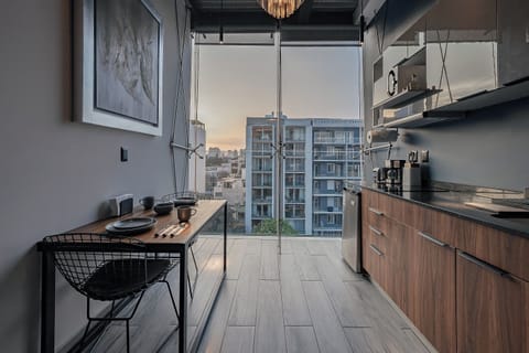 Deluxe Loft, 1 Queen Bed, Kitchenette, City View (2) | Private kitchen | Shared fridge, microwave, coffee/tea maker, electric kettle