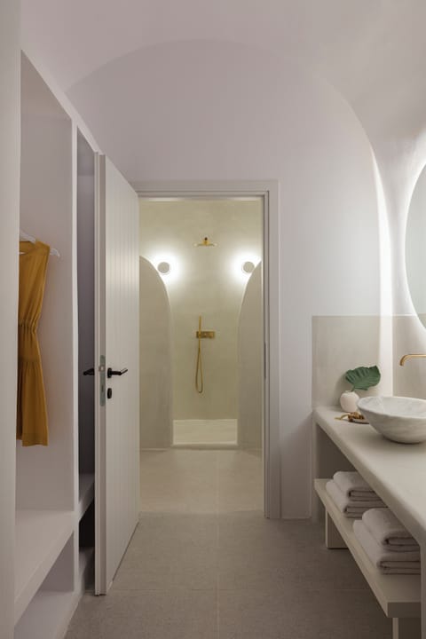 Designer toiletries, hair dryer, slippers, towels