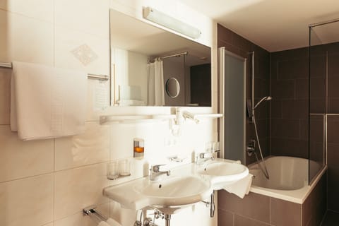 Family Suite, 3 Bedrooms, Balcony | Bathroom | Free toiletries, hair dryer, bathrobes, slippers
