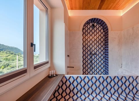 Deluxe Double Room | Bathroom | Rainfall showerhead, eco-friendly toiletries, hair dryer, bathrobes