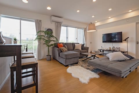 Deluxe House | Living area | Flat-screen TV