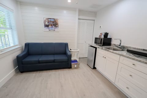 Siesta Suite - Pool Area | Living area | 50-inch TV with cable channels