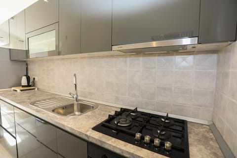 Superior Apartment, 2 Bedrooms, Sea View | Private kitchen | Full-size fridge, oven, stovetop, dishwasher