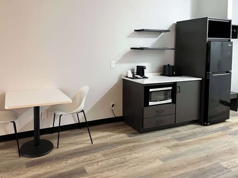 Desk, laptop workspace, blackout drapes, iron/ironing board