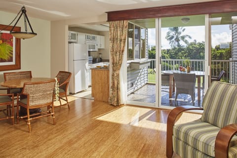 Premium Condo, 1 Bedroom, Kitchen, Garden View | Living area | TV, DVD player, iPod dock