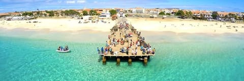 Beach nearby, white sand, beach towels, beach bar
