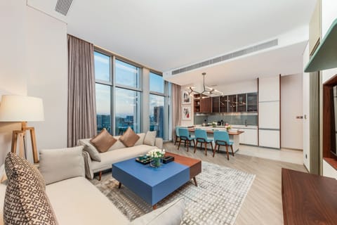 Qiu Ya One-Bedroom Elegant Suite | Living area | 55-inch LCD TV with digital channels, toys, books