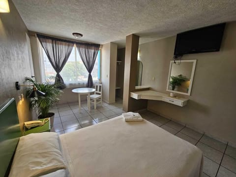 Economy Room, 1 Double Bed | Individually decorated, individually furnished, desk, laptop workspace