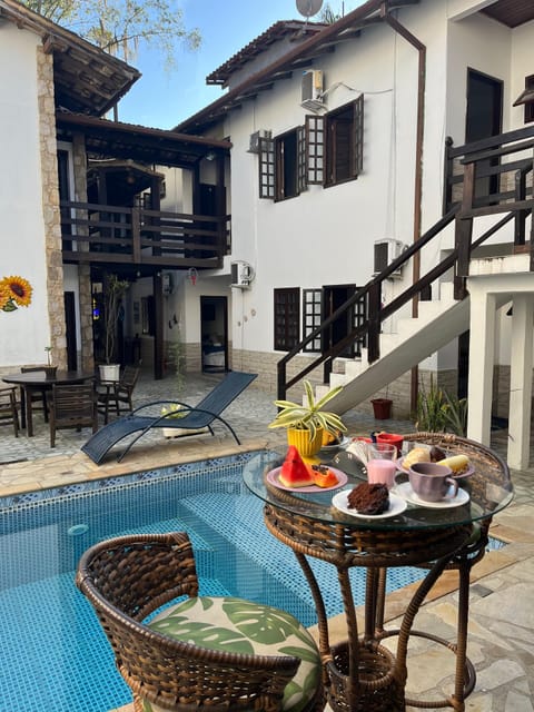 Outdoor pool, open 10:00 AM to 10:00 PM, pool umbrellas, sun loungers