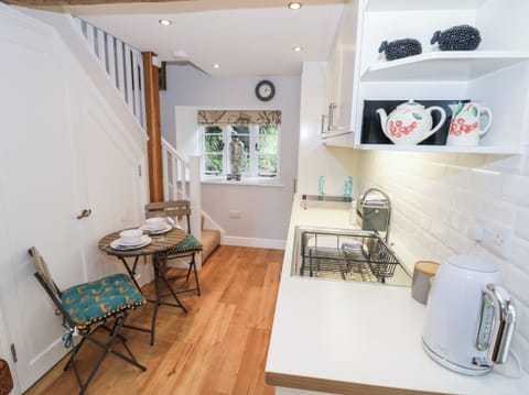 Fridge, electric kettle, cookware/dishes/utensils