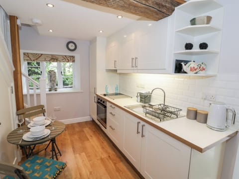 Fridge, electric kettle, cookware/dishes/utensils