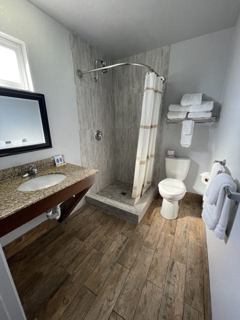 Deluxe Room, 2 Queen Beds, Non Smoking | Bathroom | Shower, hair dryer, towels