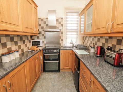 Fridge, electric kettle, toaster, cookware/dishes/utensils