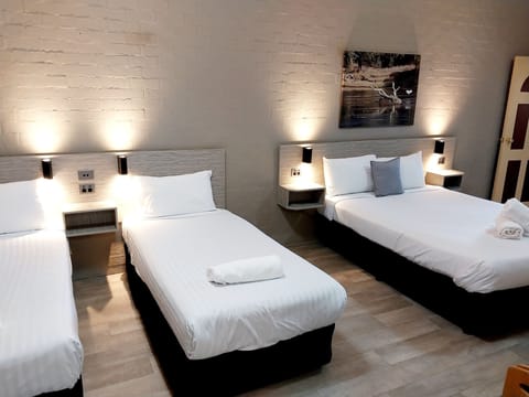 1 Room Queen and 2 singles (Pet Friendly) | Blackout drapes, free WiFi, bed sheets