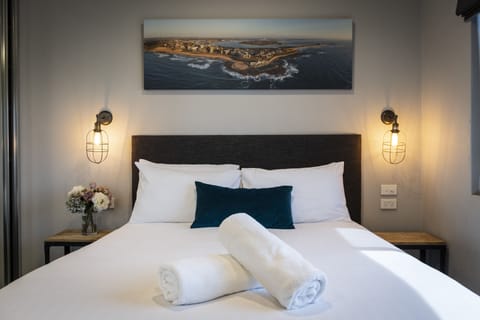 Two Bedroom Apartment with Pool View | Blackout drapes, iron/ironing board, WiFi (free), bed sheets
