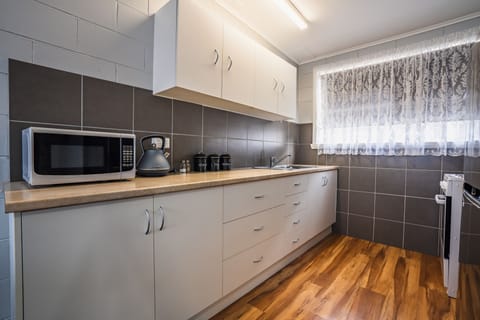 2 Bedroom Apartment | Private kitchen | Fridge, microwave, stovetop, coffee/tea maker