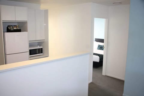 Two Bedroom Apartment | Private kitchen | Fridge, microwave, cookware/dishes/utensils