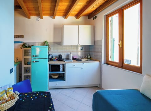 Apartment, 1 Bedroom, Balcony | Private kitchen | Full-size fridge, microwave, stovetop, espresso maker