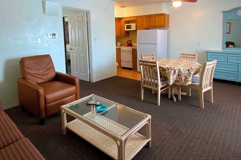 Deluxe Apartment, 2 Double Beds, Courtyard Area | Living area | 42-inch TV with cable channels