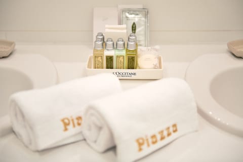 Shower, designer toiletries, hair dryer, bathrobes