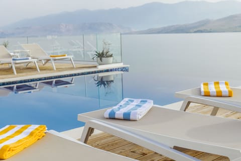 Seasonal outdoor pool, pool umbrellas, sun loungers