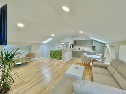 Family Apartment | Living area | 50-inch LCD TV with cable channels