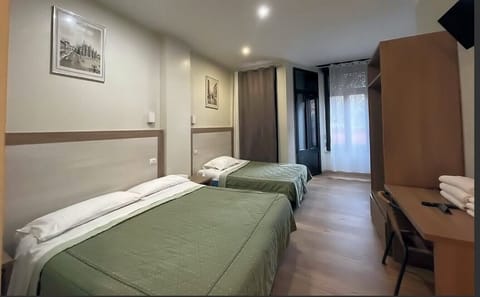 Economy Triple Room | Iron/ironing board, free WiFi