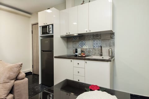 Apartment | Private kitchen | Full-size fridge, microwave, electric kettle, cookware/dishes/utensils