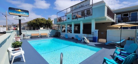 Outdoor pool, open 10:00 AM to 8:00 PM, pool umbrellas, sun loungers