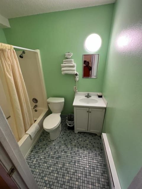 Standard Single Room | Blackout drapes, iron/ironing board, free WiFi, bed sheets