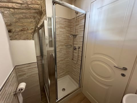 Comfort Room, 1 Double Bed, City View, Ground Floor | Bathroom | Shower, hair dryer, towels