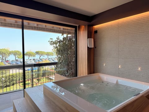 Junior Suite, Hot Tub, Partial Lake View | Premium bedding, down comforters, minibar, in-room safe
