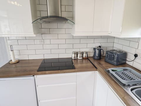 Fridge, electric kettle, cookware/dishes/utensils