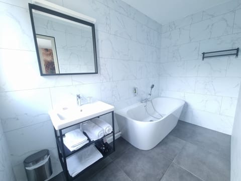 Bathtub, hair dryer, towels