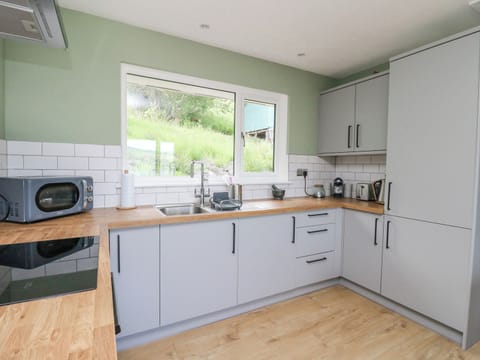 Fridge, electric kettle, toaster, cookware/dishes/utensils