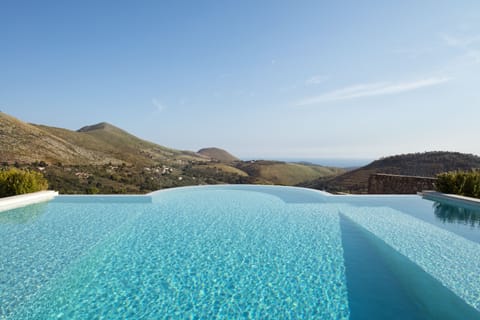 Seasonal outdoor pool, an infinity pool, sun loungers