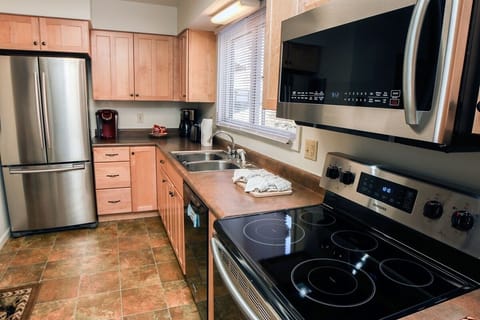Condo, 2 Bedrooms | Private kitchen | Fridge, oven, coffee/tea maker