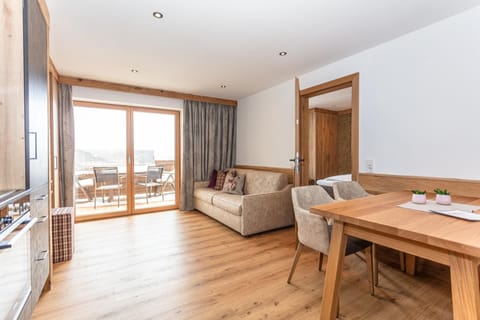 Comfort Condo, 1 Bedroom, Balcony | Living area | Flat-screen TV