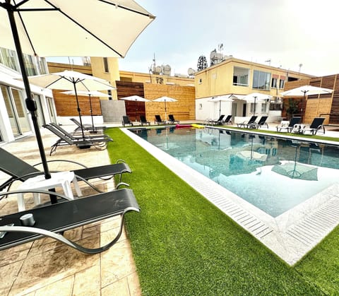 Seasonal outdoor pool, open 8:00 AM to 8:00 PM, pool umbrellas