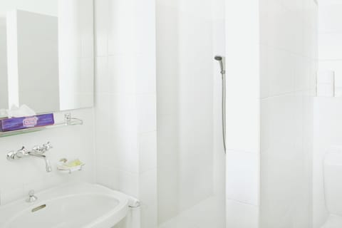 Shower, free toiletries, hair dryer, slippers