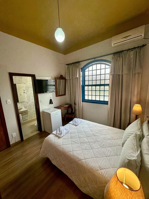 Standard Double Room | Minibar, desk, laptop workspace, blackout drapes