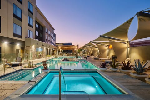Outdoor pool, open 6:00 AM to 11:00 PM, free cabanas, sun loungers