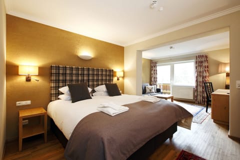 Superior Suite, Balcony, Mountain View | In-room safe, desk, free WiFi, bed sheets