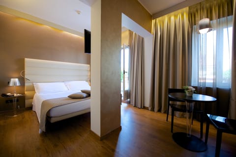 Deluxe Room, Balcony | Down comforters, in-room safe, individually furnished, desk