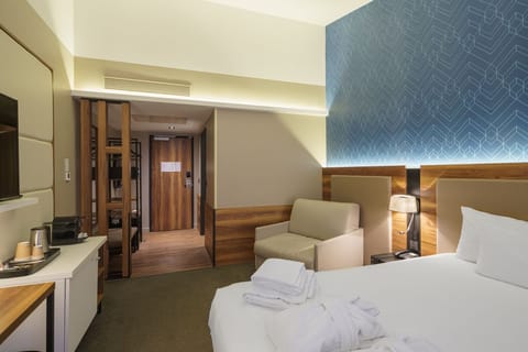 Premium Triple Room | Premium bedding, in-room safe, desk, blackout drapes